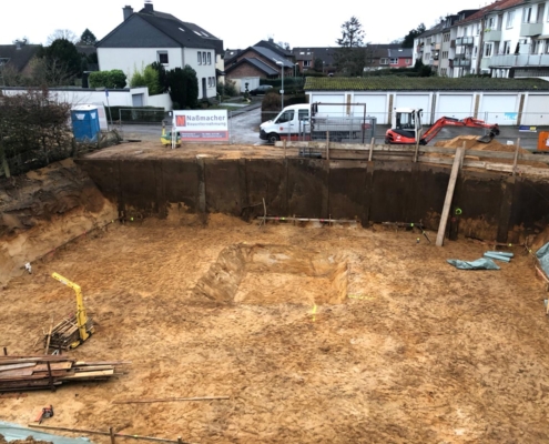 Mehrfamilienhaus Rohbau, Wesel bauen, Architekten, Nassmache Bauunternehmung, Rohbau, Borken, Fundament, Stahlbetonwände, Stahlbetonarbeiten, Bodenplatten setzen, Baustelle Wesel